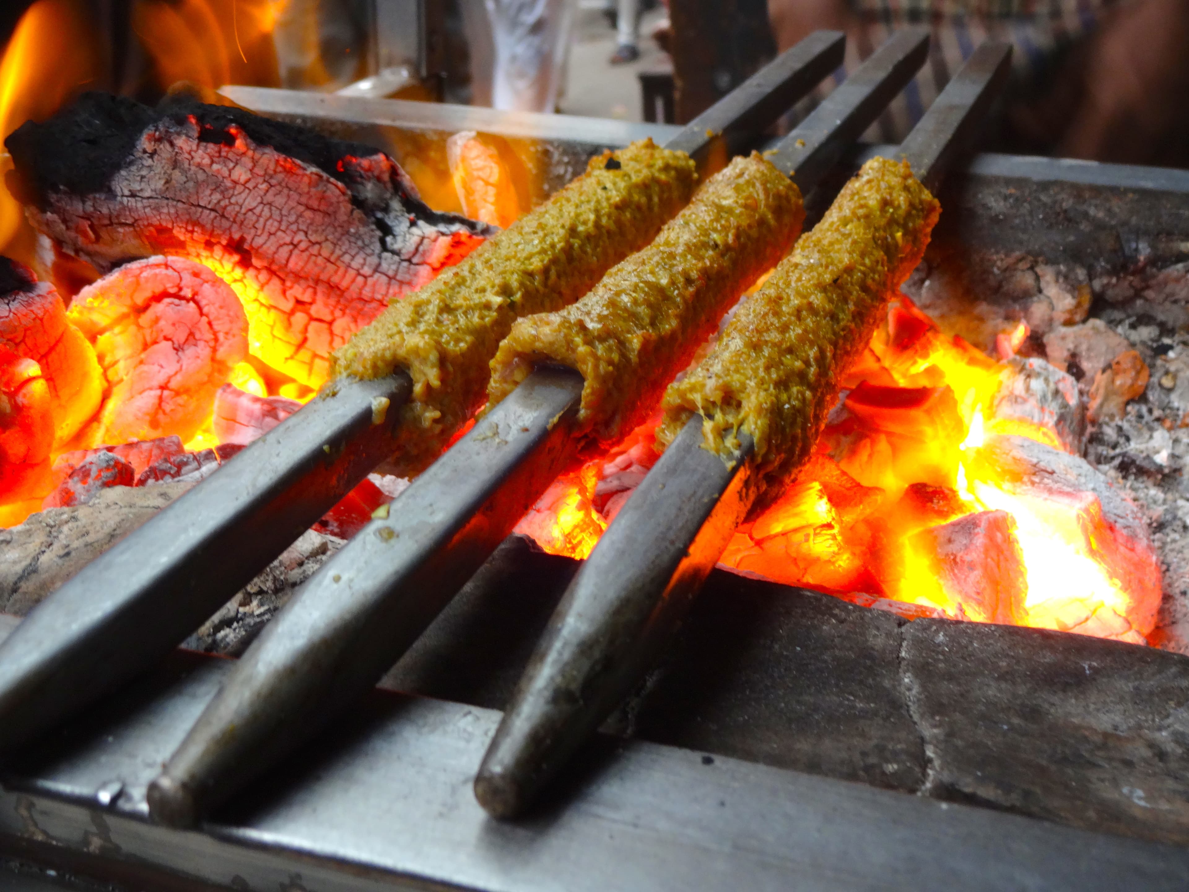 Seekh kebabs arranged with fresh garnish